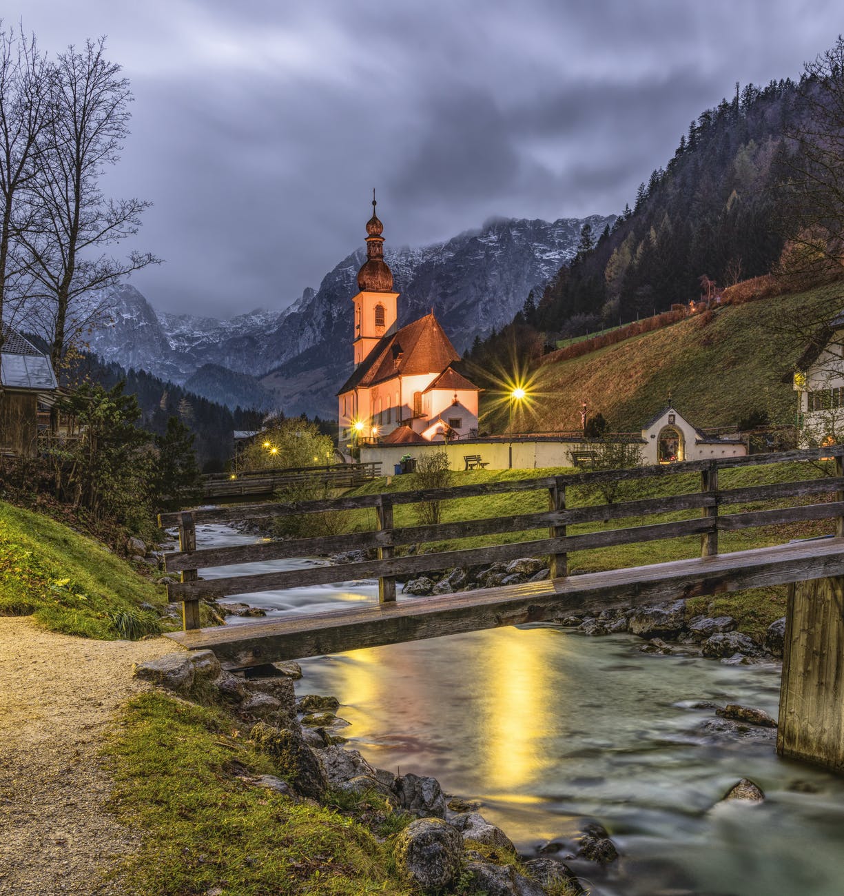 brown and beige house with background of mountain