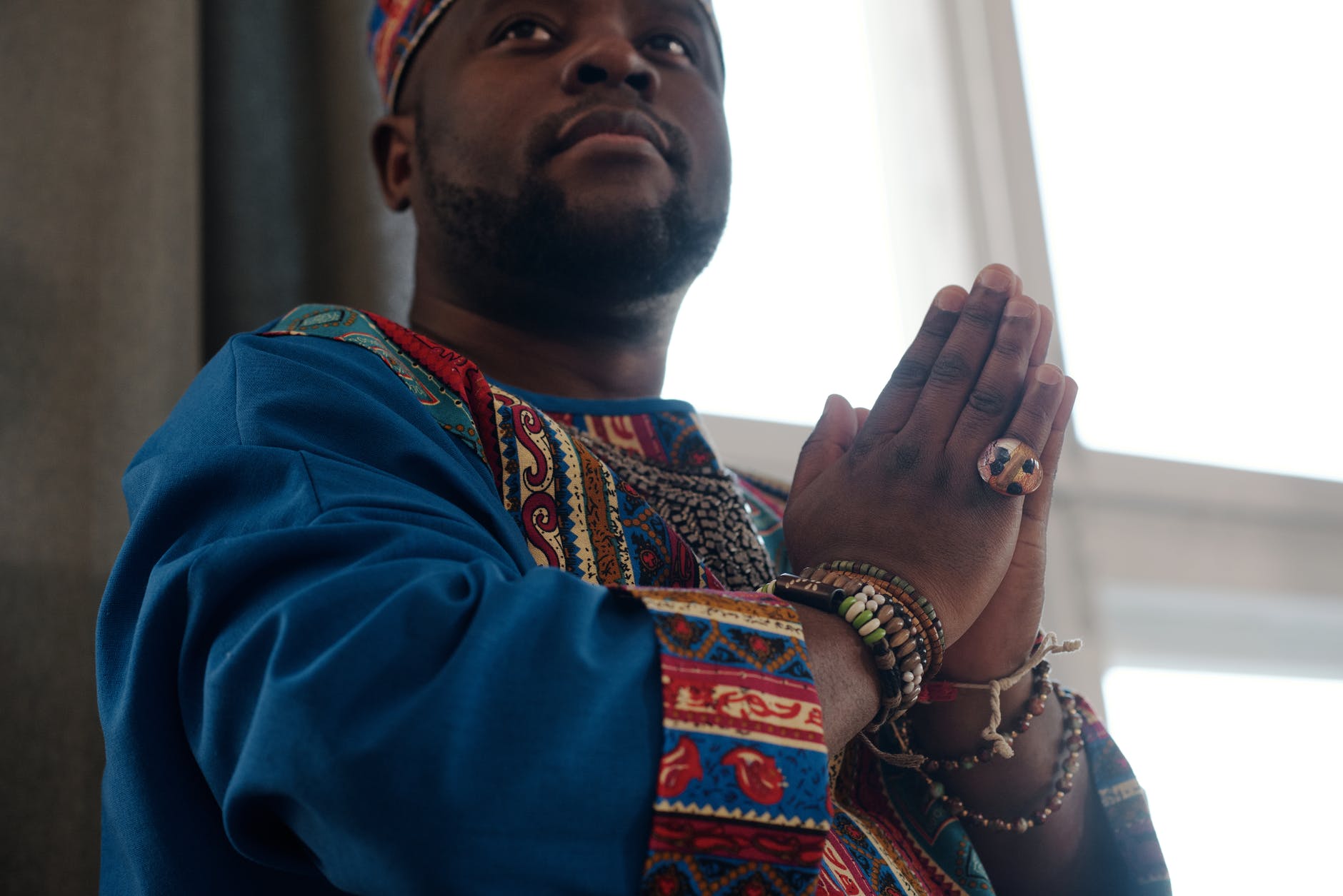 close up photo of man with praying hands