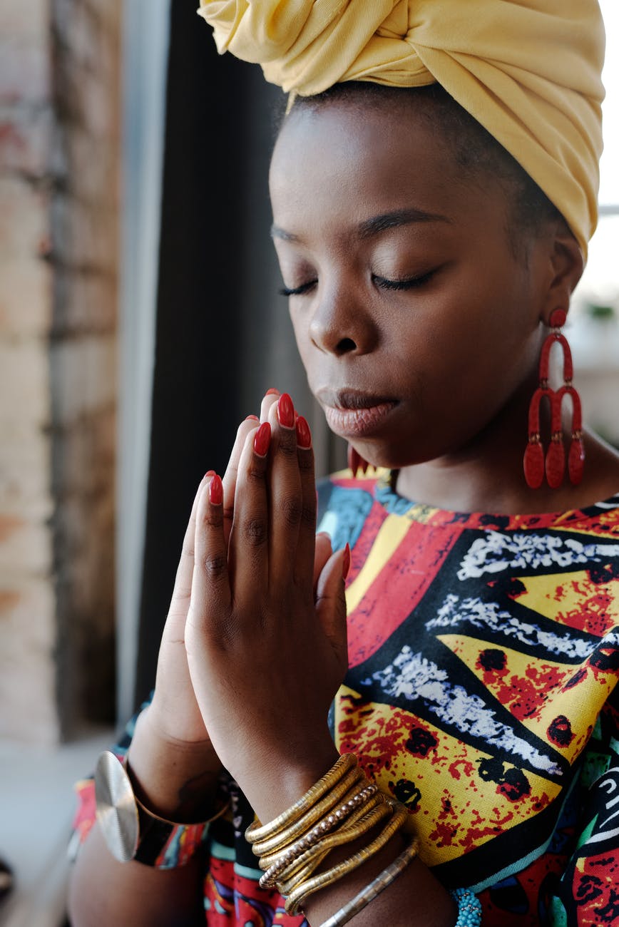 close up photo of woman praying