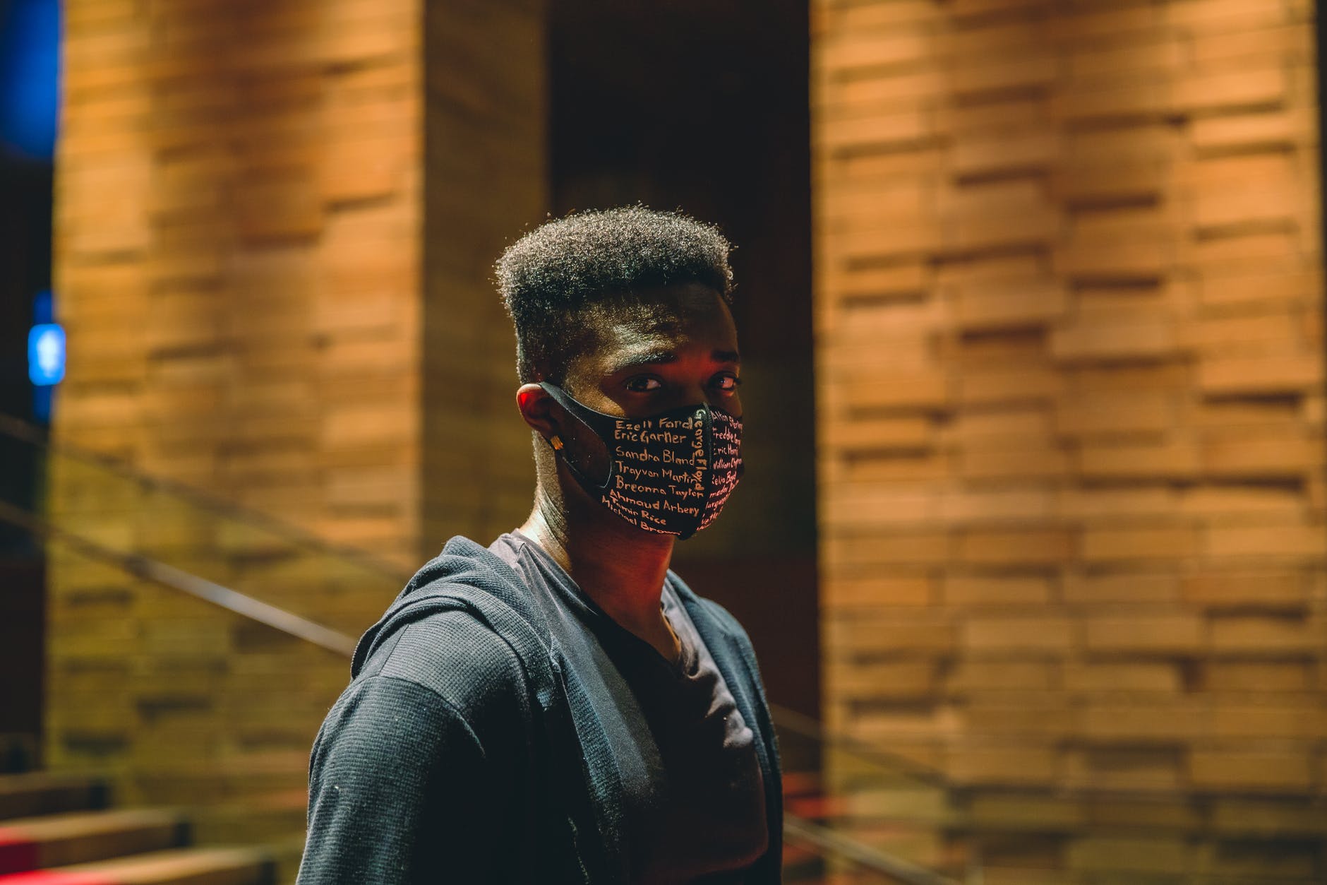 serious black man in protective mask