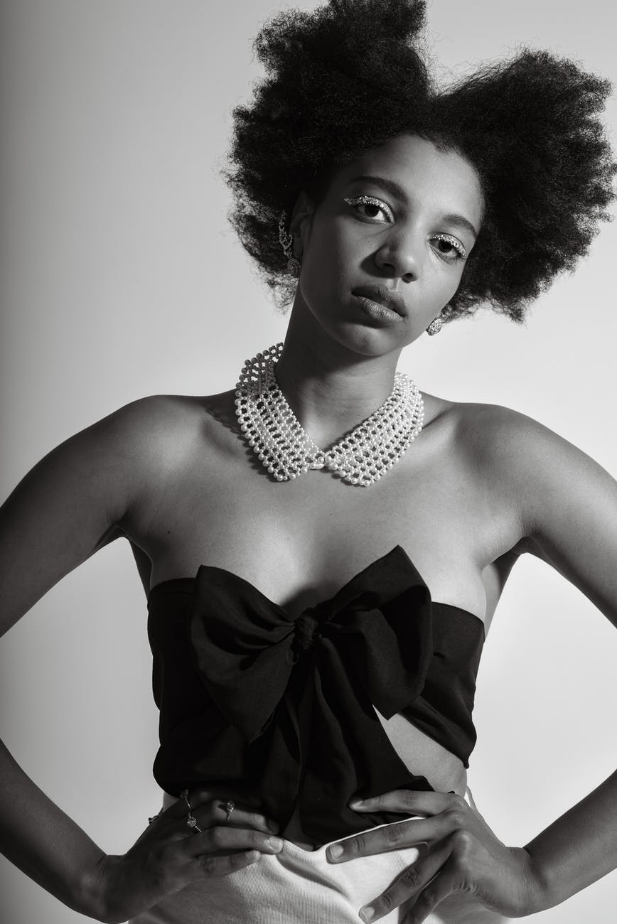 gorgeous stylish black woman with naked shoulders in studio