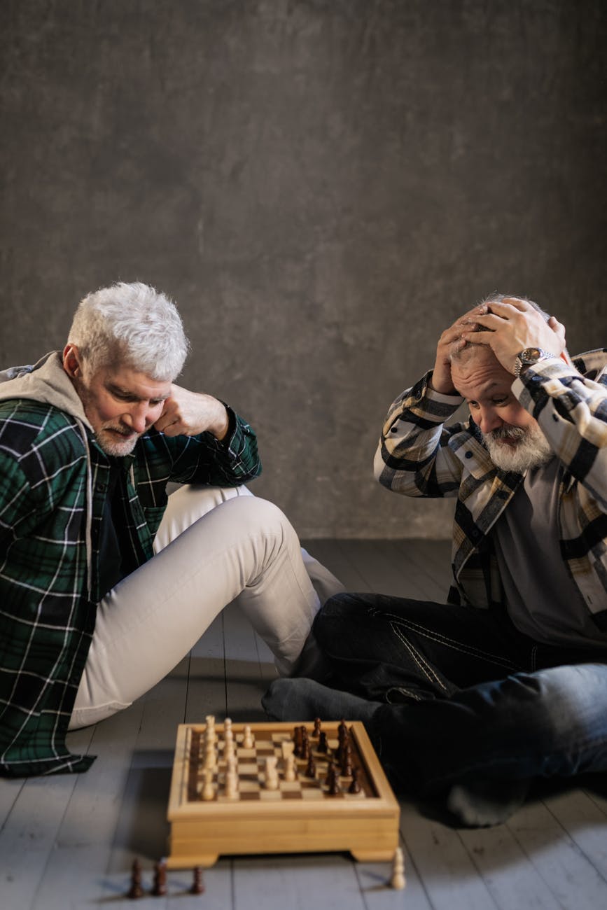 elderly men playing chess