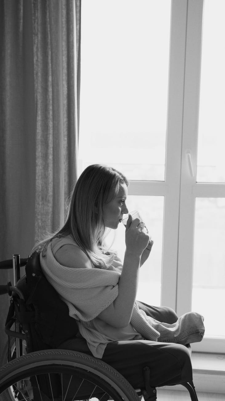 woman in white tank top sitting on chair